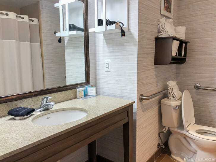 a bathroom with a sink and mirror
