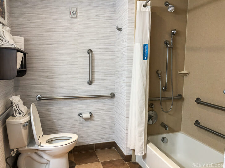 a bathroom with a toilet and bathtub