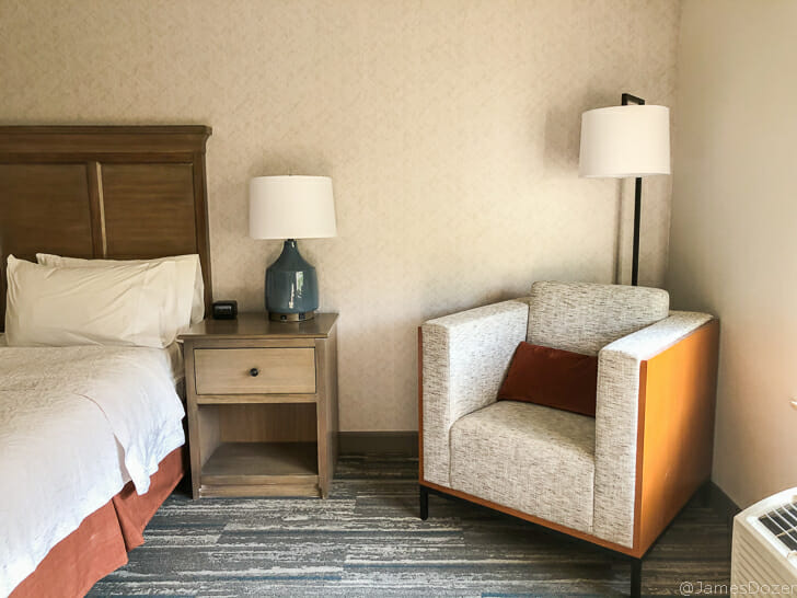 a room with a bed and a chair