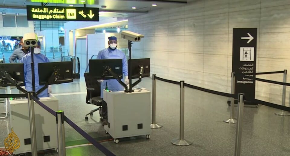 a person in a mask and a mask on a computer
