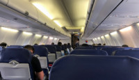 a group of people sitting in an airplane