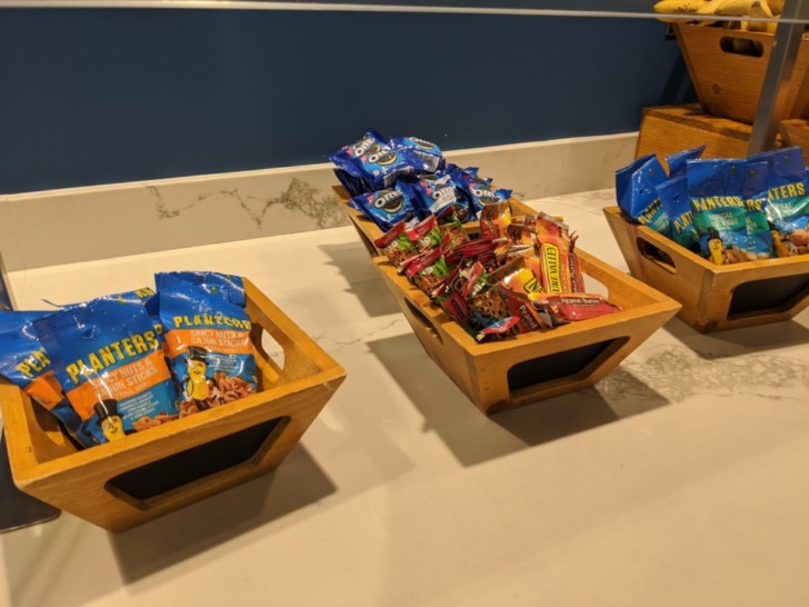 a group of wooden baskets of candy