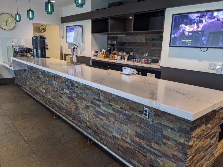 a counter with a tv on the wall