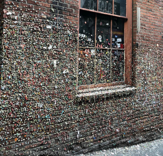 a brick building with many gums on it