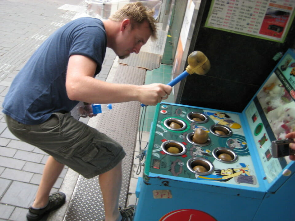 a man holding a rubber mallet