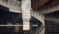 a spiral staircase with crystal chandeliers