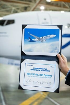 a hand holding a certificate