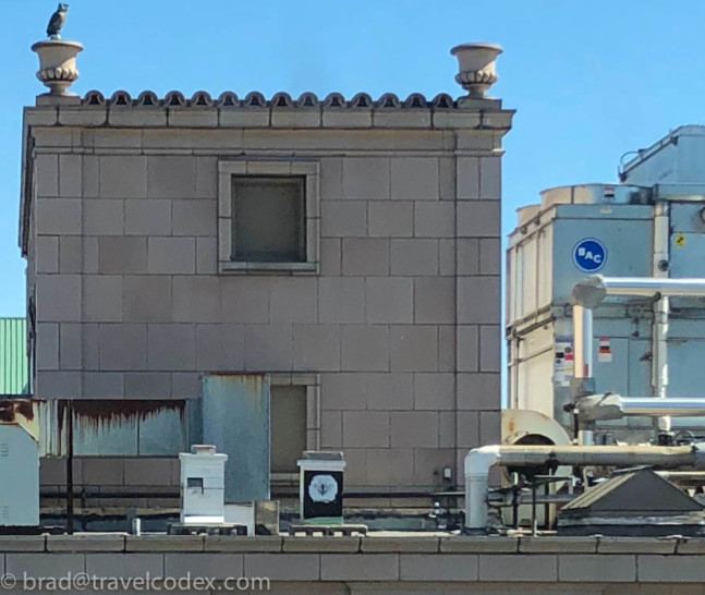 a building with a couple of pipes on top of it