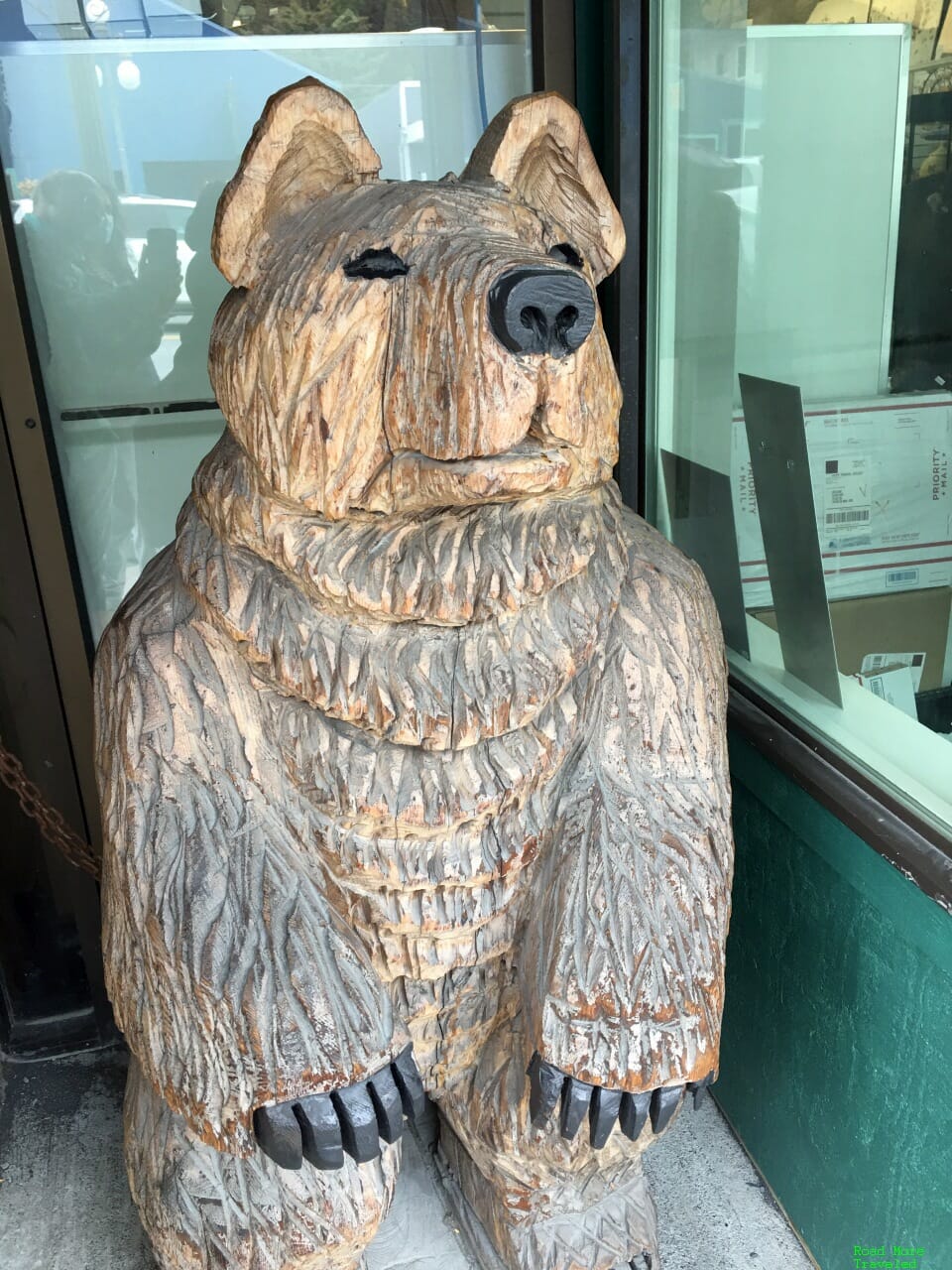 Lonely grizzly on a chair in Seward, Alaska