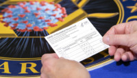 a hand holding a card
