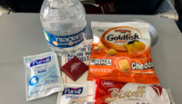 a bottle of water and snacks on a table