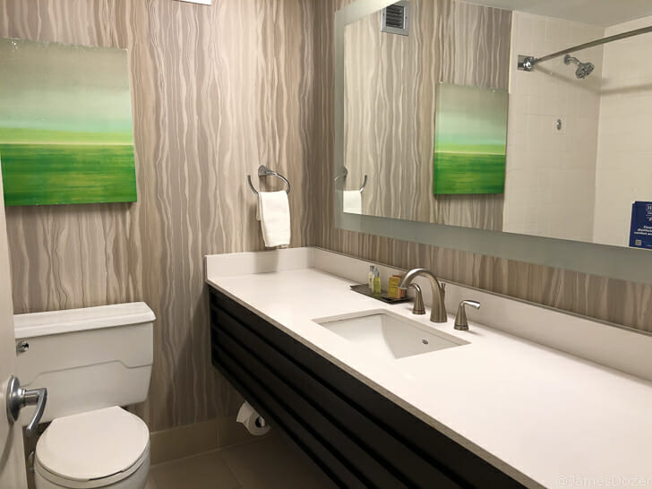 a bathroom with a mirror and sink