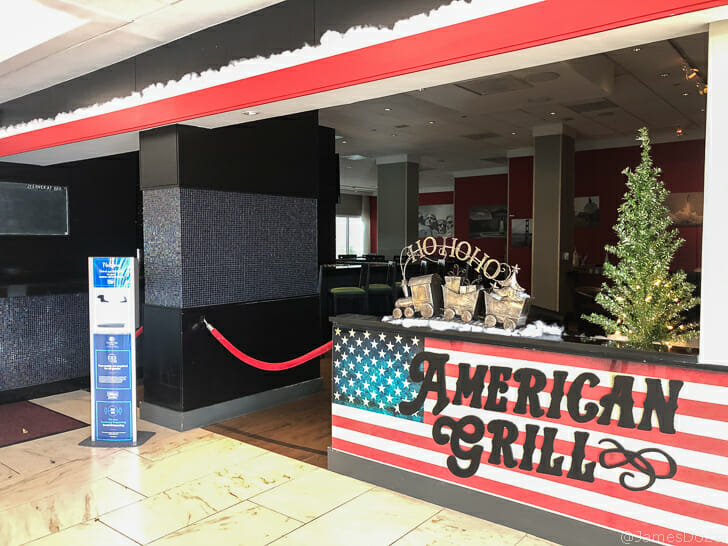 a bar with a christmas tree in front of it