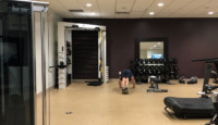 a person doing push ups in a gym