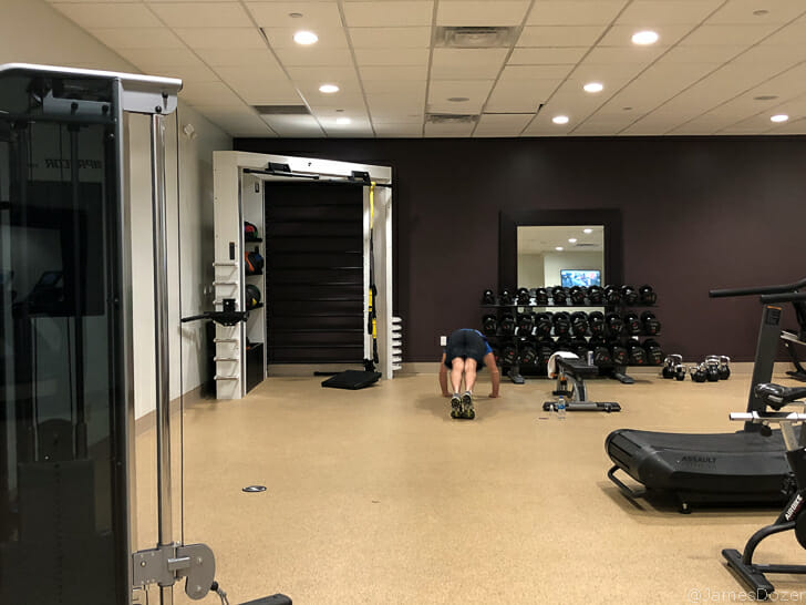 a person doing push ups in a gym