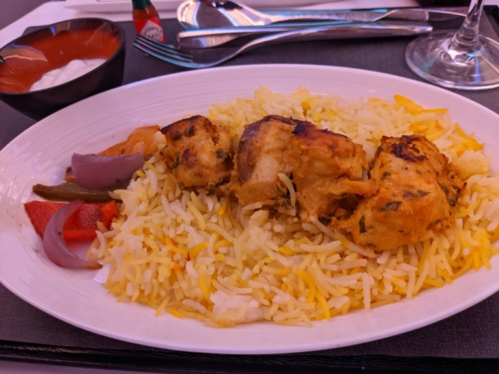 a plate of rice and meat