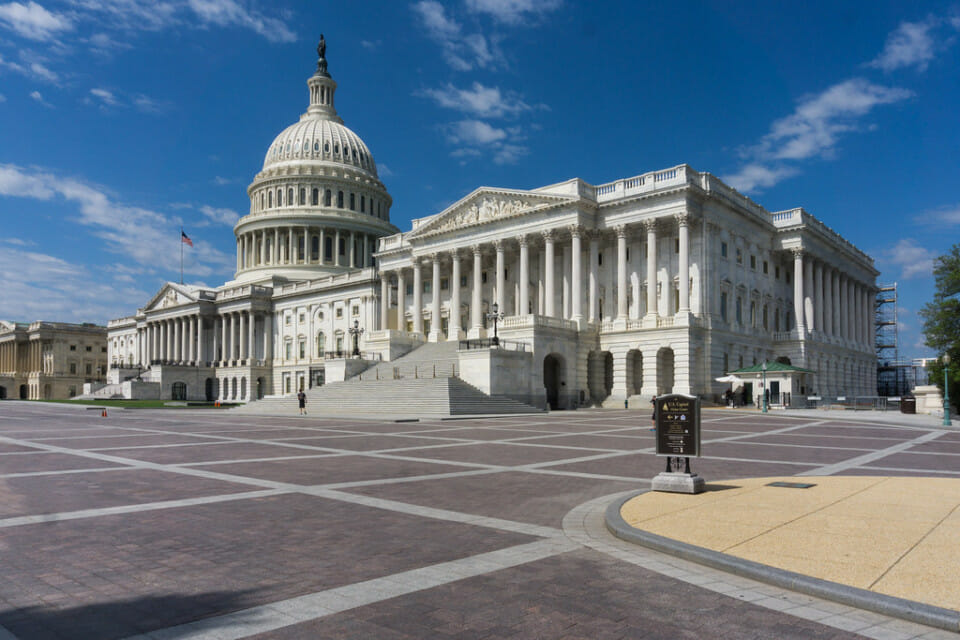 a large white building with a dome on the side