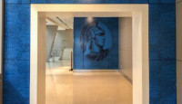 a blue wall with a picture of a man on it