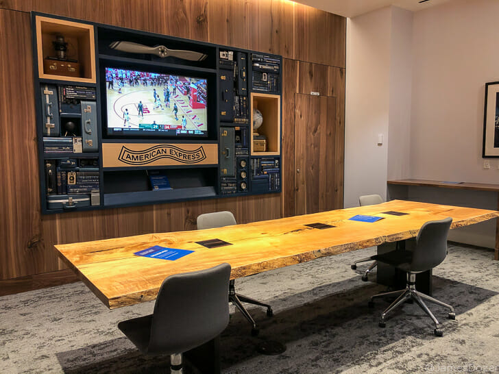 a table with chairs and a television on the wall