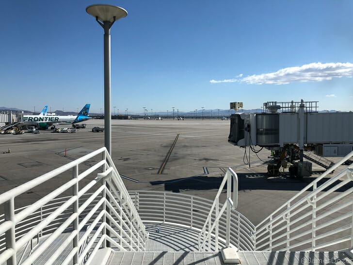 a white staircase leading to an airport