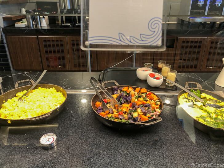 a group of bowls of food on a counter
