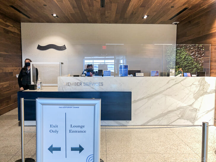 a person standing behind a counter