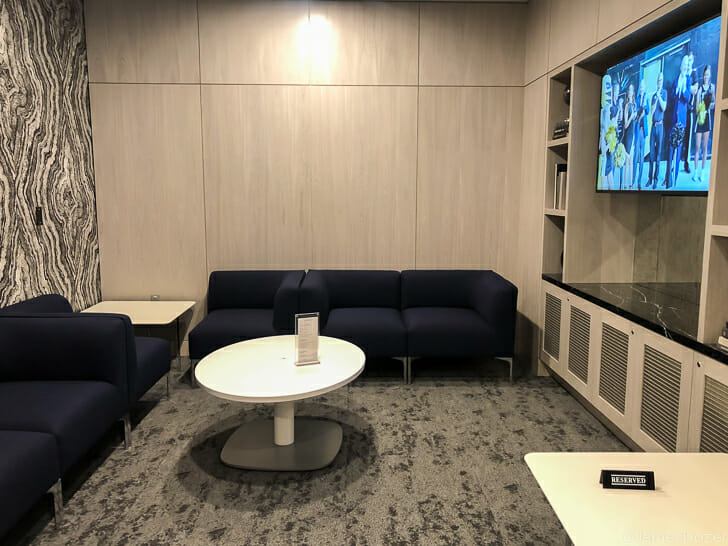a room with couches and a tv
