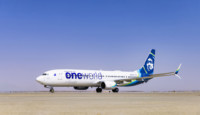 a white airplane on a runway