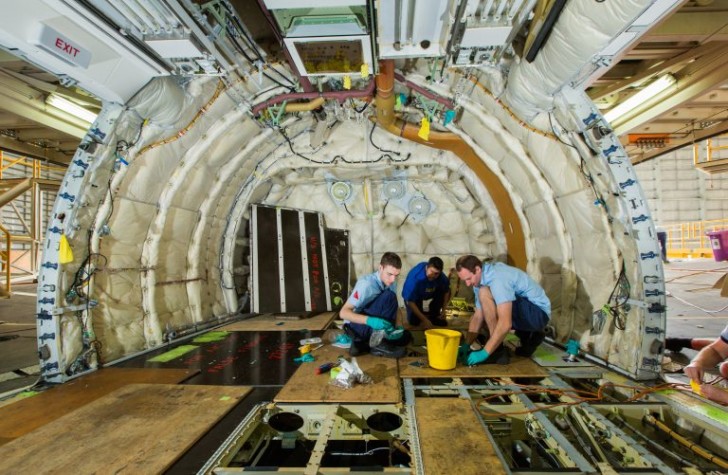 a group of men working in a plane