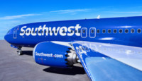 a blue airplane with white writing on it