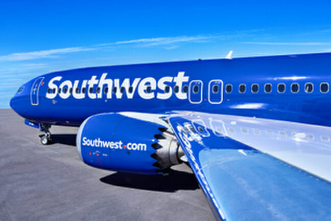 a blue airplane with white writing on it