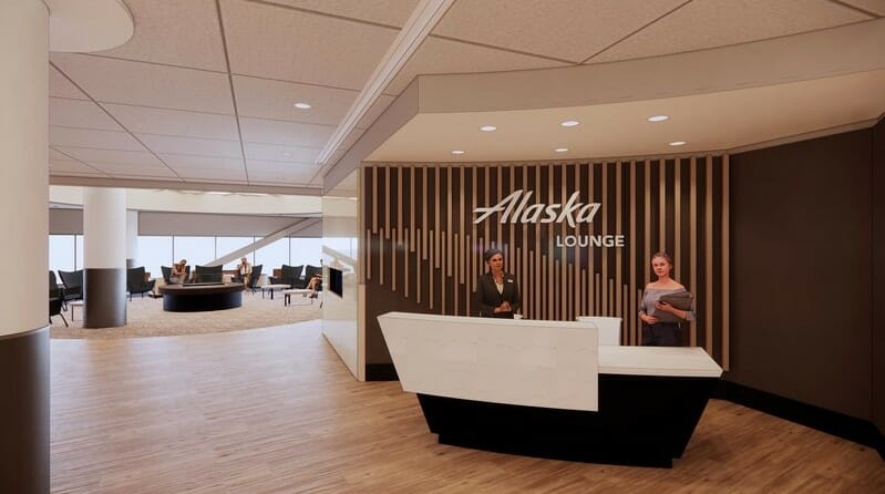 a group of people standing at a reception desk