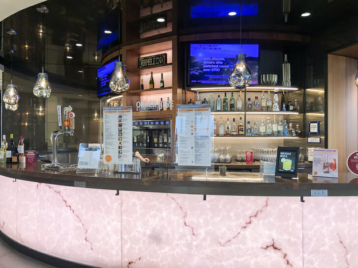 a bar with a counter and a sign