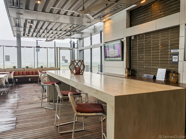 a room with a long table and chairs