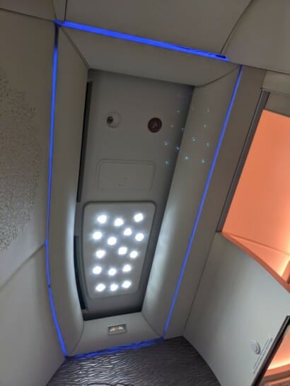 a ceiling with lights and a blue strip