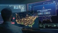 a man looking at a map on a computer screen