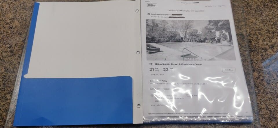 a folder with a picture of a pool and a picture of a swimming pool