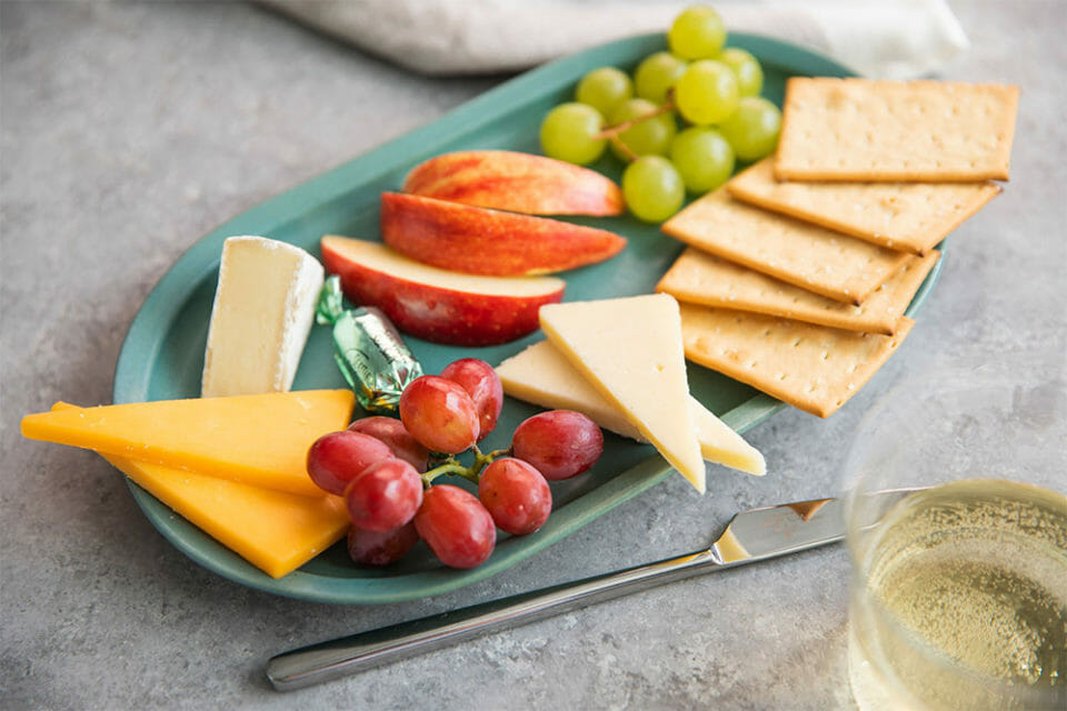a plate of food and a glass of wine