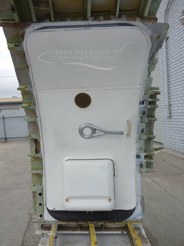 a white door with a hole in the back