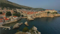 a city on a cliff by water
