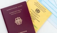 a passport and a medical mask