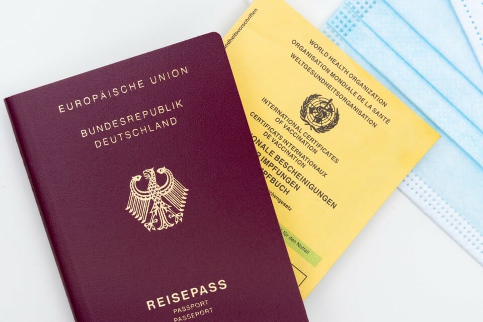 a passport and a medical mask