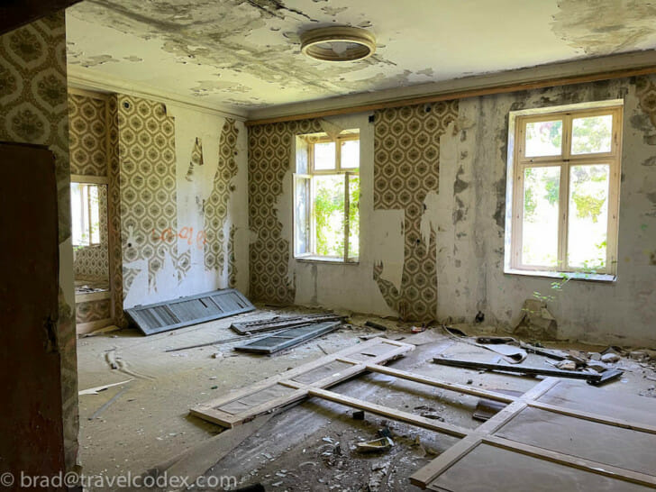 a room with broken doors and windows