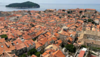 an aerial view of a city with red roofs