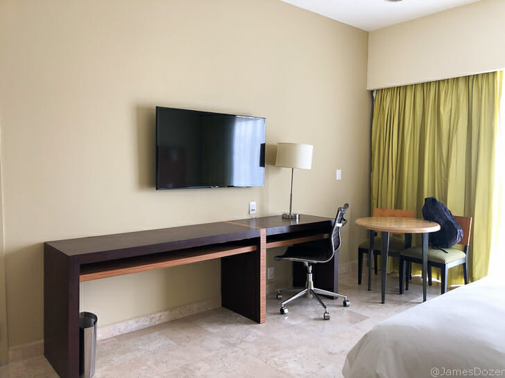 a room with a television and table