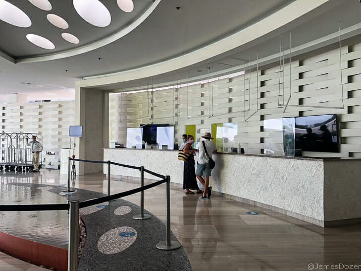 people standing in front of a reception desk