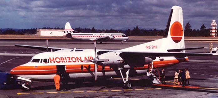 a group of airplanes on the runway