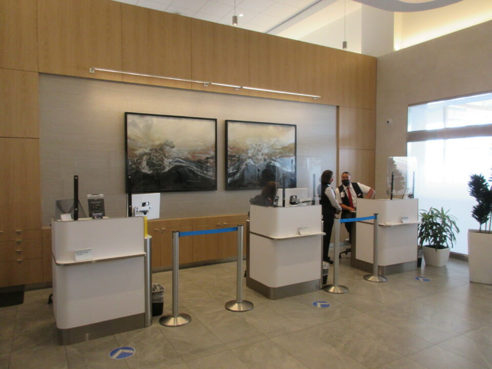 people standing at a counter in a building