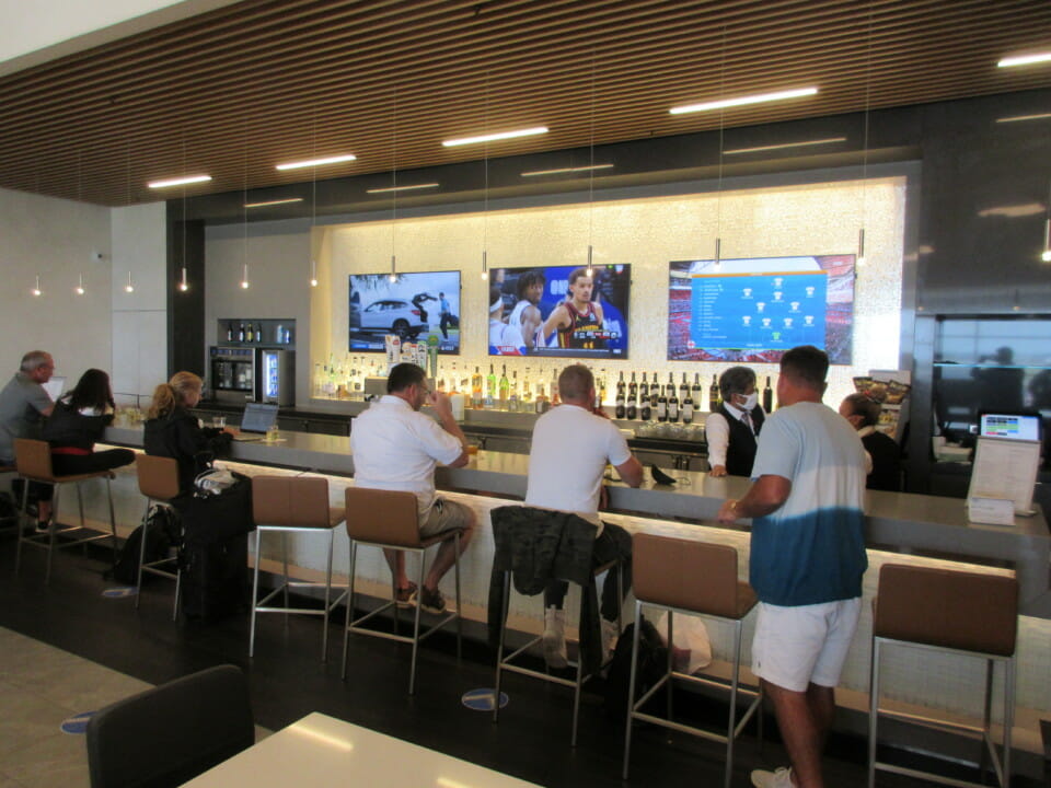 a group of people sitting at a bar