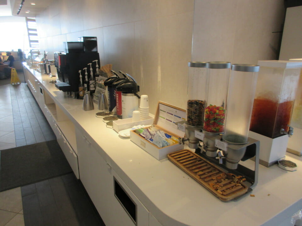 a counter with coffee machines and other items